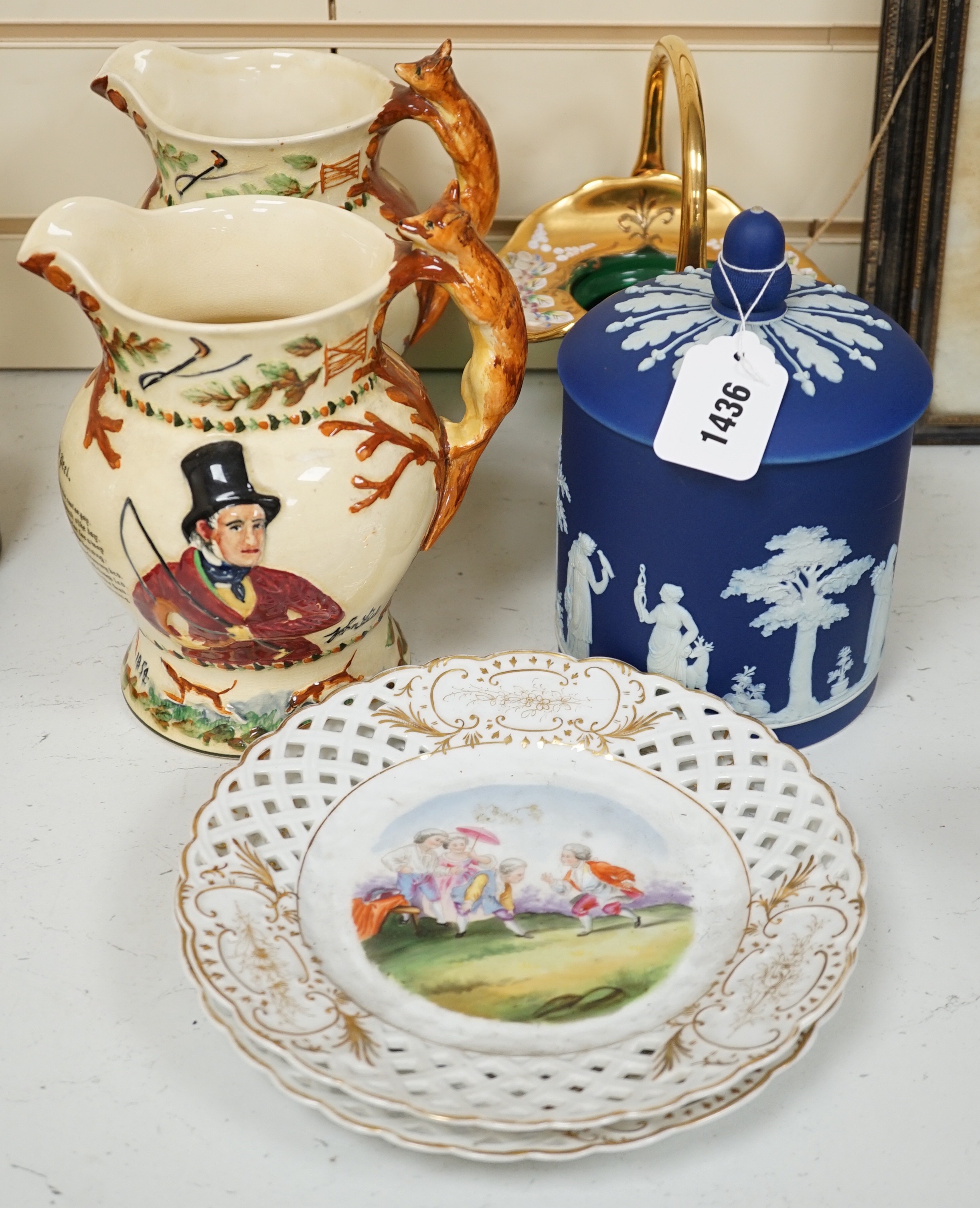 A pair of John Peel musical character jugs, a Wedgwood Jasper Ware biscuit box, enamel green glass basket and a pair of basket figural ceramic plates.